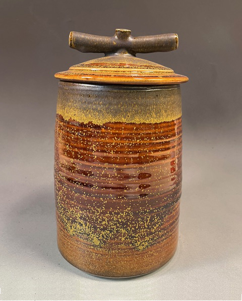 Brown toned, lidded ceramic vessel